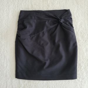 H&M black mini skirt with wrap detail and gold back zipper size 6
